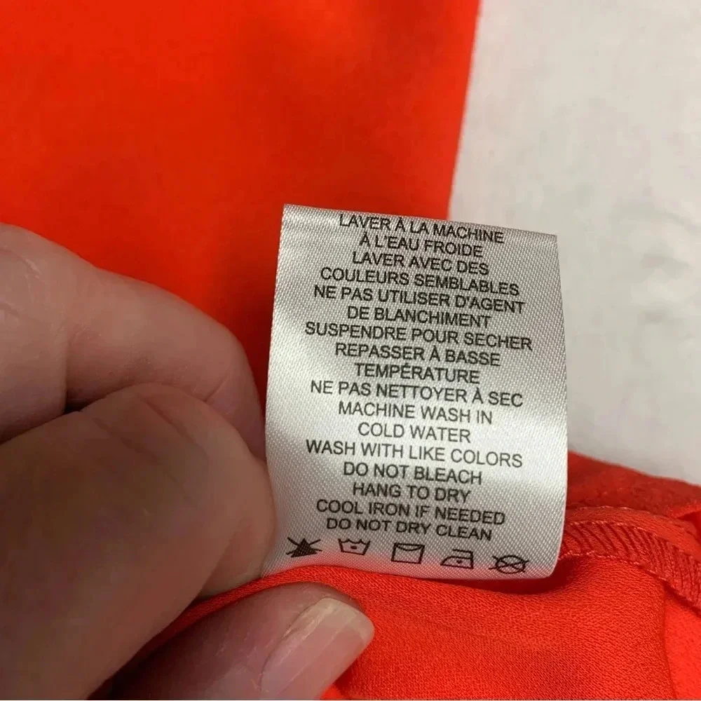 Rachel Zoe bright orange blouse size Small bold seam down the front